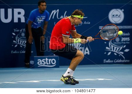 KUALA LUMPUR, MALAYSIA - OCTOBER 03, 2015: Spain's tennis player David Ferrer plays a backhand return at the 2015 Malaysian Open tennis tournament from Sep 26 - Oct 4, 2015 in Stadium Putra.