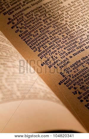 Close-up Of An Opened Dictionary Showing The Word Study