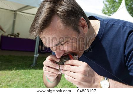 Man Eating Burger