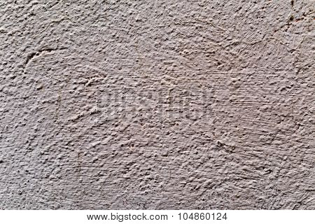 closeup of a rustic beige plastered wall to be used as a texture or a background