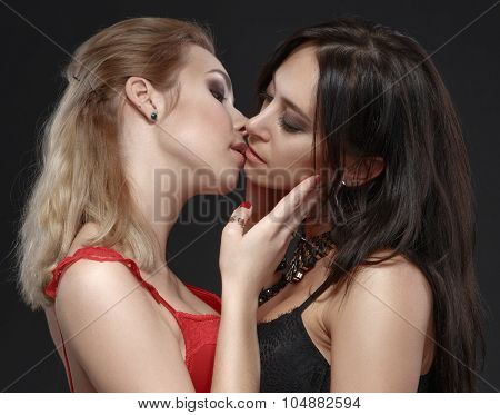 Two Young Attractive Lesbians Kissing.
