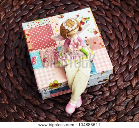 Little Dolly Sitting On The Box