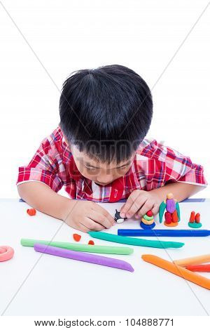 Child Moulding Whale Modeling Clay, On White Background. Strengthen The Imagination