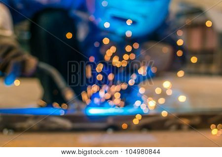 Heavy Industry Welder Worker In Protective Mask Hand Holding Arc Welding Torch Working On Metal Cons