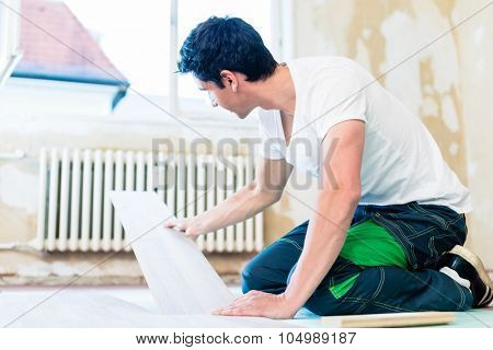 Floorer working in home in improvement project