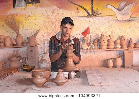 Ceramics. Manual production. A man at work.