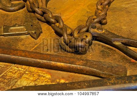 Desk With Old And Rusty Locksmith Tools