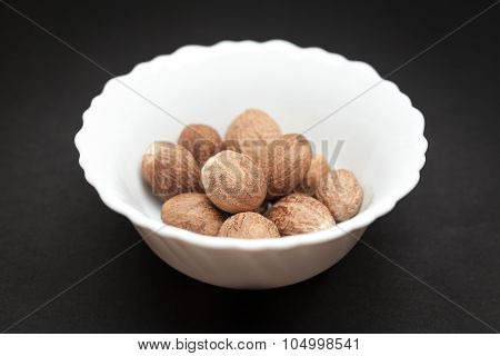 Organic Nutmeg Seed in white bowl.