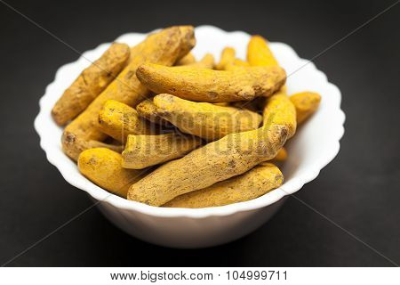 Organic Long Turmeric in white bowl.