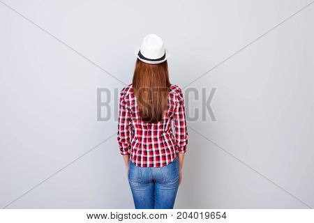 Back View Snap Model Shot Of Young Brunette Woman In Casual Outfit And Hat, Standing On Pure Light G