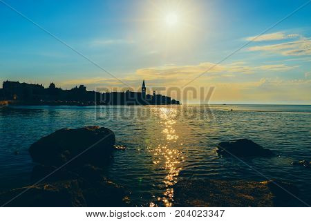Sunset On The Seashore. City View Walk Along The Seafront