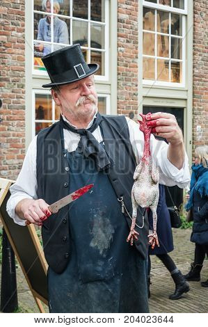 Deventer Netherlands - December 18 2016: One of the characters from the famous books of Dickens during the Dickens Festival in Deventer in The Netherlands