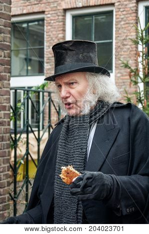 Deventer Netherlands - December 18 2016: Scrooge one of the characters from the famous books of Dickens during the Dickens Festival in Deventer in The Netherlands