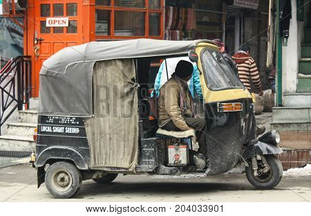 SHIMLA, India - January 20: Autorickshaw or three wheel bike on a street,which is a famous traditional taxi.on January 20,2011 in SHIM LA,India.