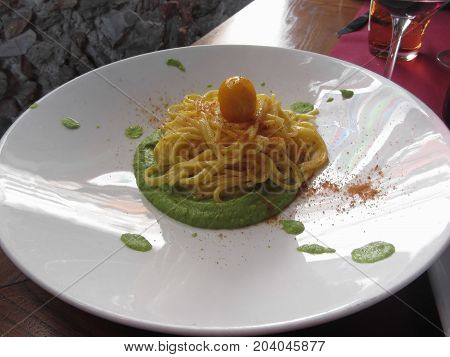 Spaghetti with bottarga on asparagus sauce . Italian recipe