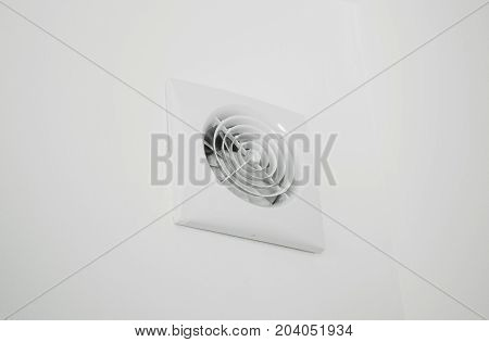 Wall electric extractor fan in the kitchen