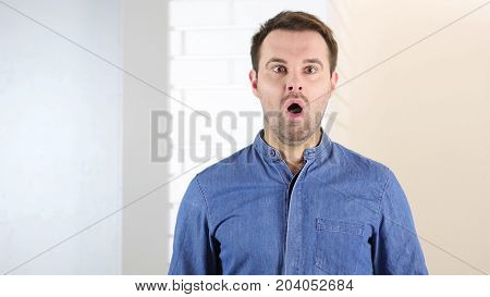 Shock, Wondeirng Middle Aged Man In Office At Work