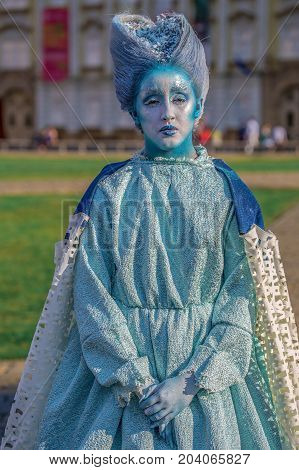 TIMISOARA ROMANIA - SEPTEMBER 8 2017: Living statue of a woman dressed with winter elements and present on the street inside the CheckART Carnival organized by the City Hall Timisoara. Union Square.