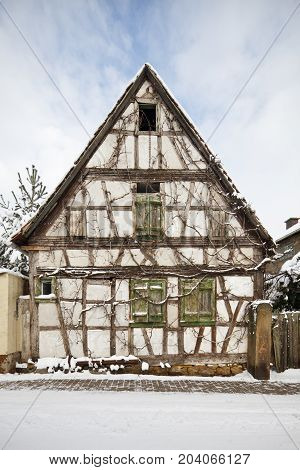 Overgrown Half-timbered House In Village, Germany