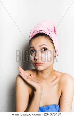 Surprised young woman with a mask under the eyes.Sad
