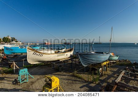 POMORIE BULGARIA - AUGUST 17 2017: Fishing boats on the shore. Seaport of the seaside town of Pomorie.