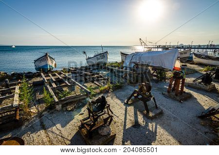 POMORIE BULGARIA - AUGUST 17 2017: Fishing boats on the shore. Seaport of the seaside town of Pomorie.