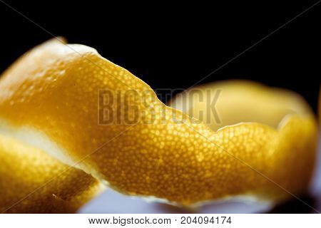 Citrus essential oil, vitamin c serum, beauty care aroma therapy. Macro close up of peel of Lemon. Inside and outside of Lemon.