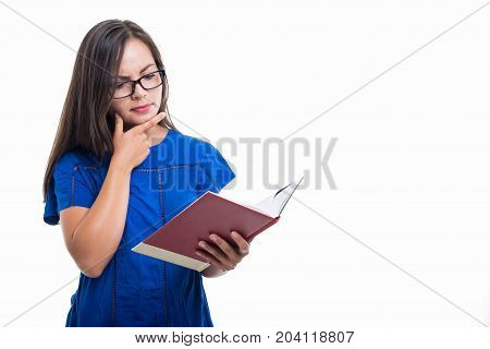 Portrait Of Student Girl Holding Notebook And Thinking