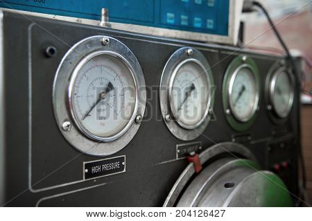 close-up high pressure diesel fuel pump test bench on work