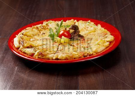 Japanese food , close-up Okonomiyak i.(Japanese pizza)