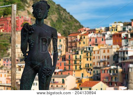 Statue della Vendemmia in Manarola in National park Cinque Terre, Liguria, Italy
