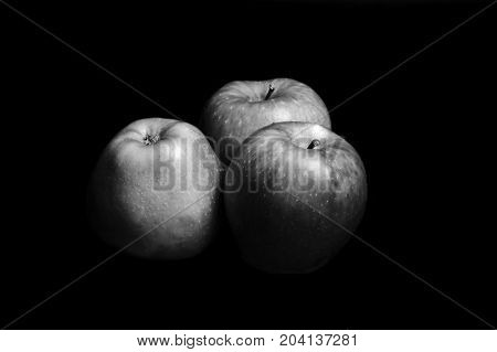 Trhee Apples With Black And White
