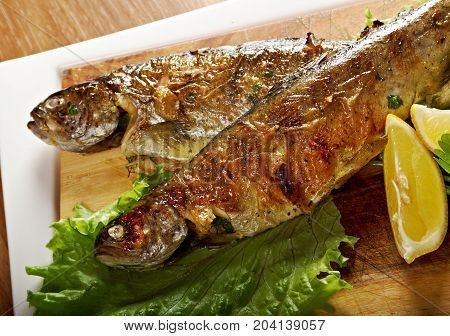 Two grilled Rainbow Trouts.Served with Vegetables closeu p   meal