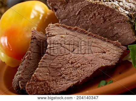 sliced rare roast beef farm-style.farmhouse kitchen , close up