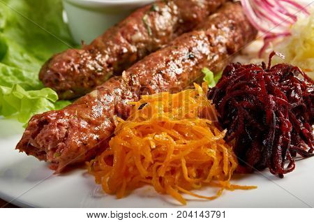 caucasian Luleh kebab with vegetable  , close up traditional meal