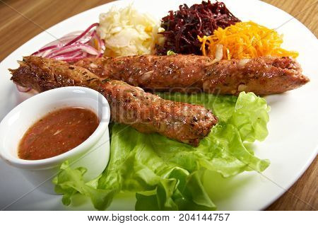 caucasian Luleh kebab with vegetable  , close up traditional meal