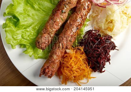 caucasian Luleh kebab with vegetable  , close up traditional meal