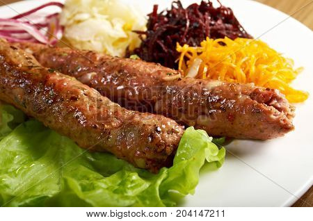 caucasian Luleh kebab with vegetable , close up