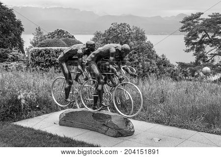 Lausanne Switzerland - May 25 2016: Cyclistes sculpture by Gabor Mihaly at Olympic museum in Lausanne Switzerland on Lake Geneva. Black and white photography.