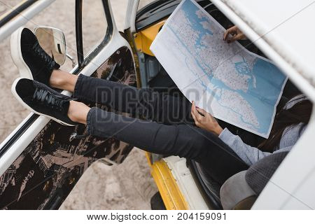 Traveler With Map In Minivan