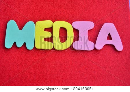 WORD MEIDIA ON A  ABSTRACT RED BACKGROUND