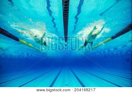 dynamic swimming competition in a blue pool