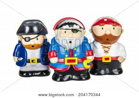 three pirate toy figures on a white underground