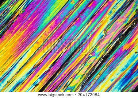 microscopic shot of urea micro crystals in polarized light