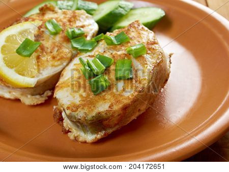 grilled t-bone codfish steak and vegetables close up homemade meal