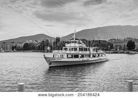 Geneva Switzerland - May 25 2016: Cruise ship named - Henry Dunant by founder of International Committee of the RC Organization based in Geneva harbour in Geneva Switzerland. Black and white photography.