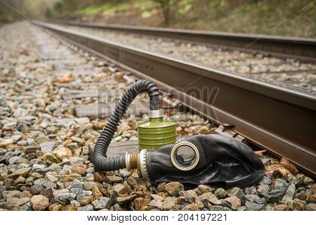 Scary authentic Russian gas mask with breathing hose abandoned in woods
