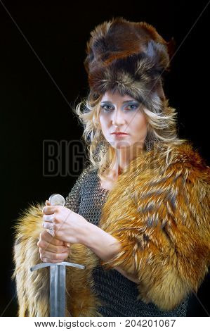 medieval Valkyrie. Viking romantic girl with sword
