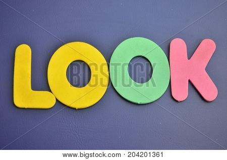 WORD LOOK ON A  ABSTRACT COLORFUL BACKGROUND