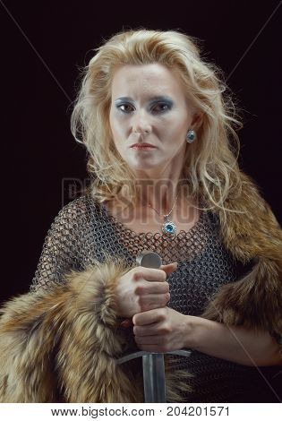 medieval Valkyrie. Viking romantic girl with sword